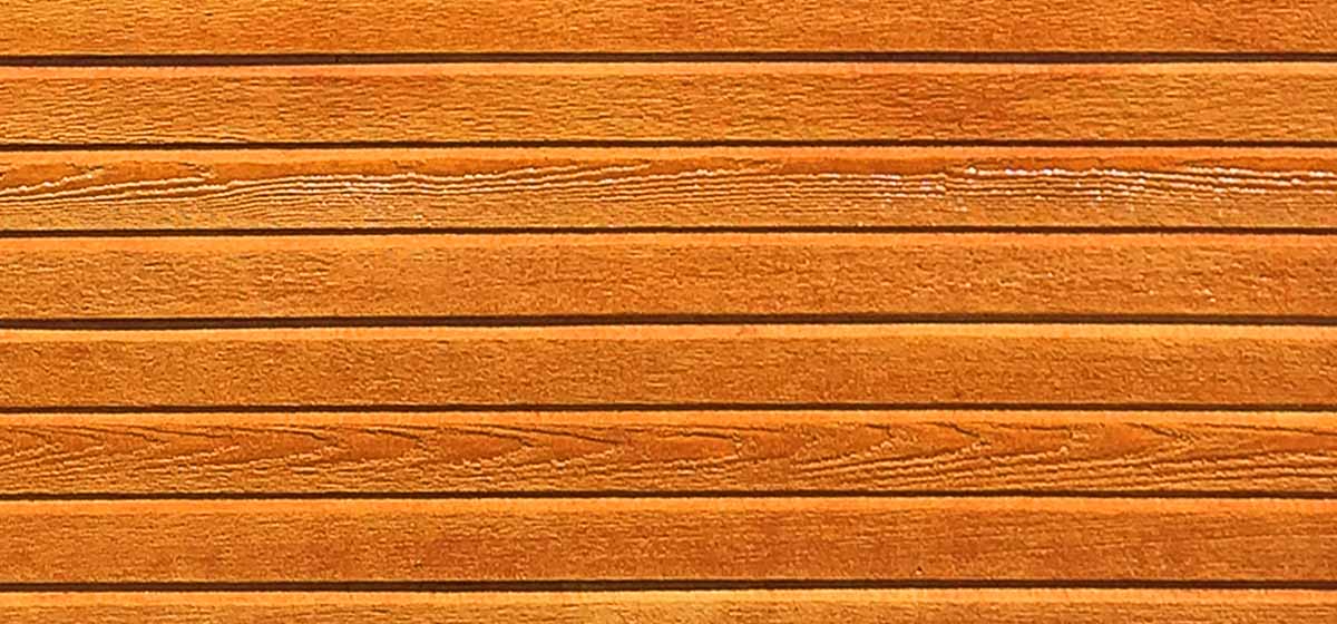 A closeup view of our new lap siding, shown in cedar stain.