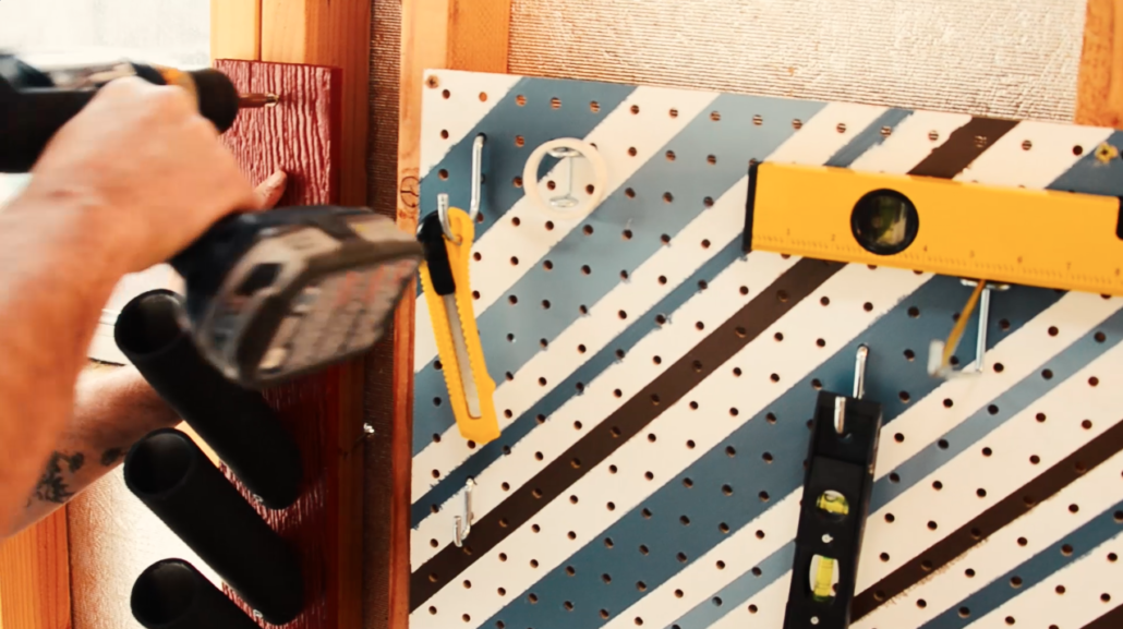 When the PVC pipe is secure, attach the organizer to the wall.