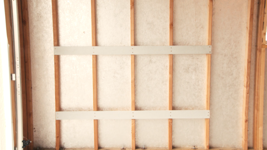 Attach the back boards to your wall, with a couple feet left between them.