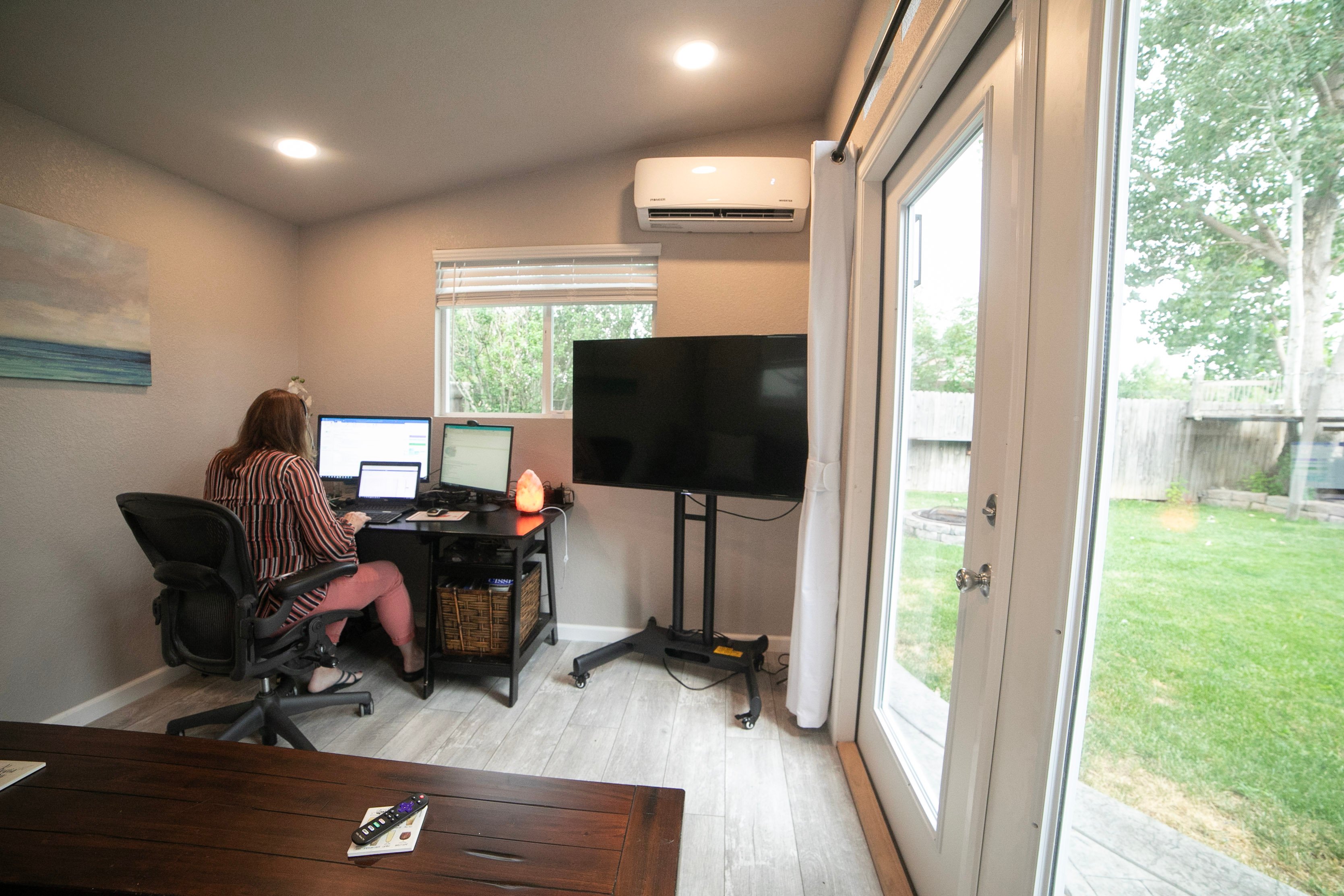 This modern studio office has room for work and outdoor living space.