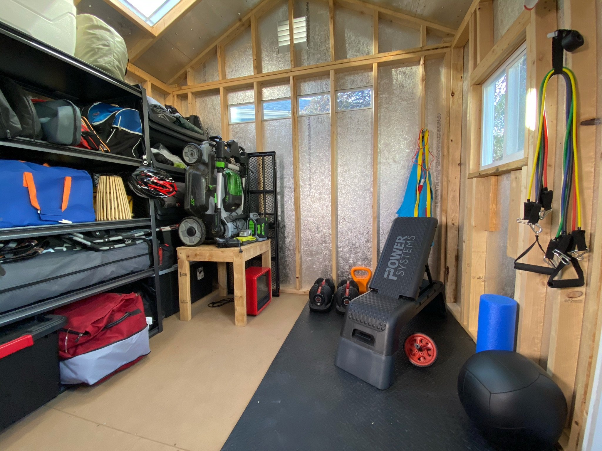 smaller shed with household and gym equipment