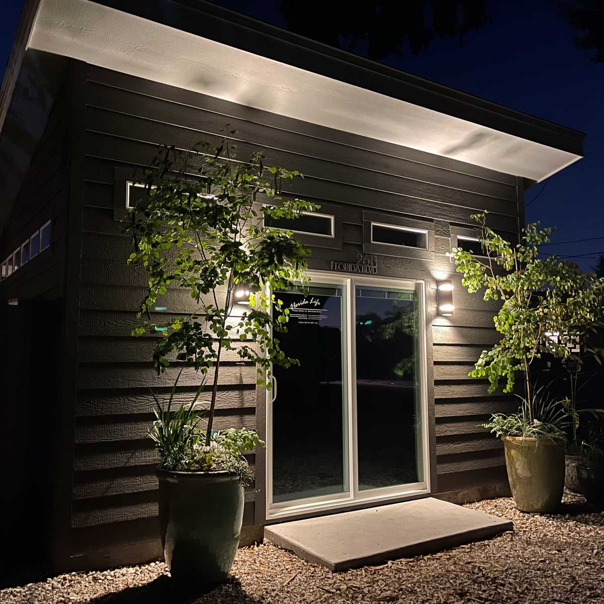 Stacy's finished home office, lit up with landscaping lighting.