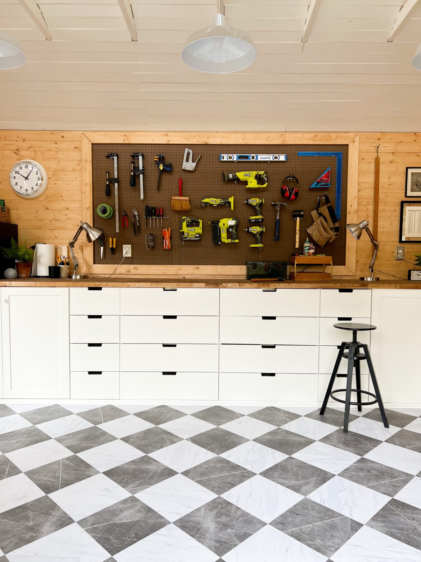 Cass' workbench and tool storage pegboard finish out the DIY workshop.