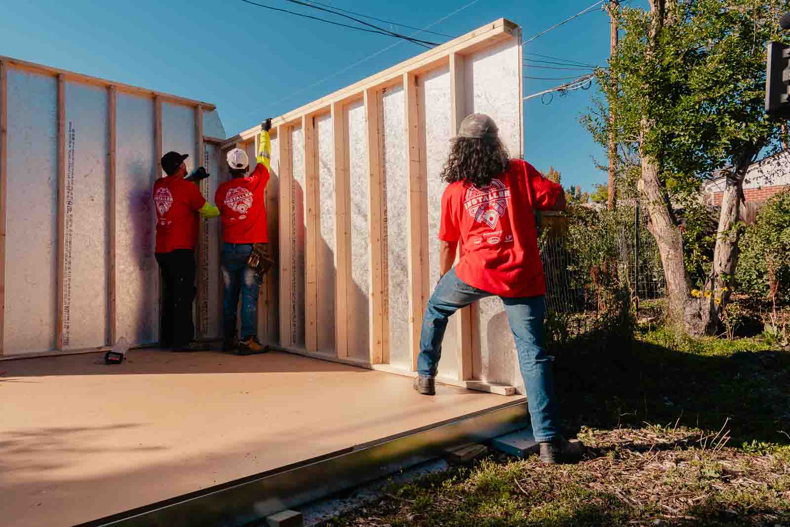 Tuff Shed installers putting up the walls of the urban barn