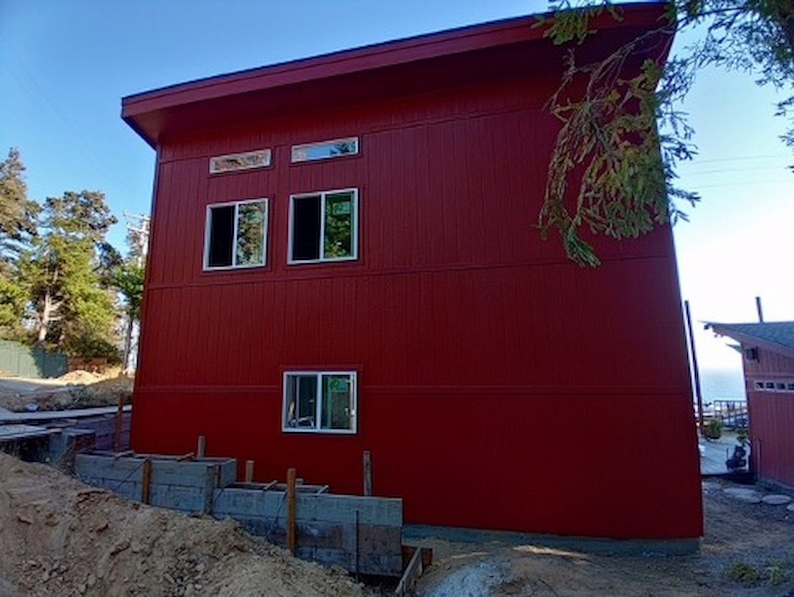 Red two story garage with windows