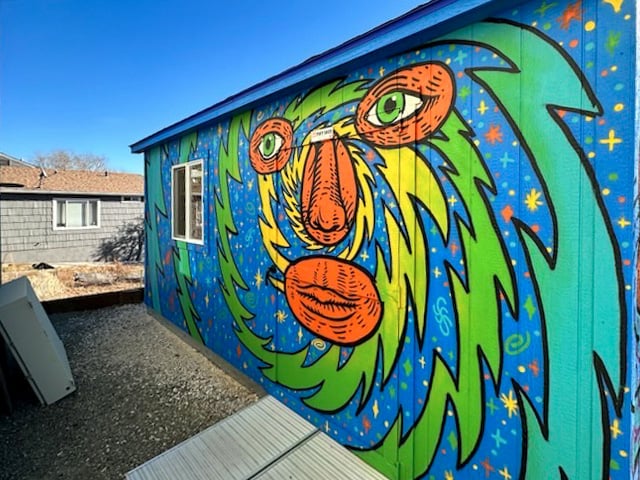 beautiful blue and colorful mural shed