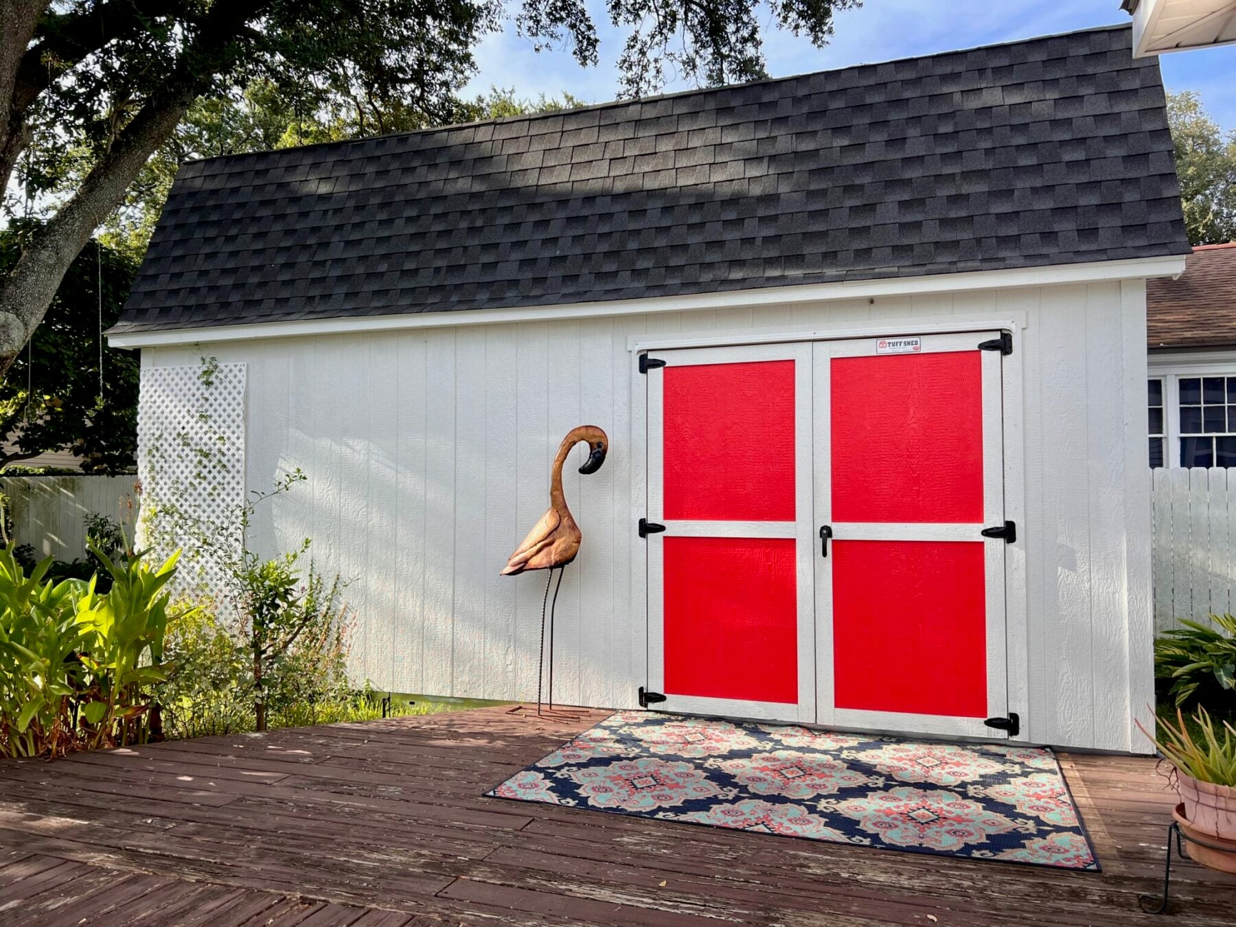 beautiful grey shed with red doors