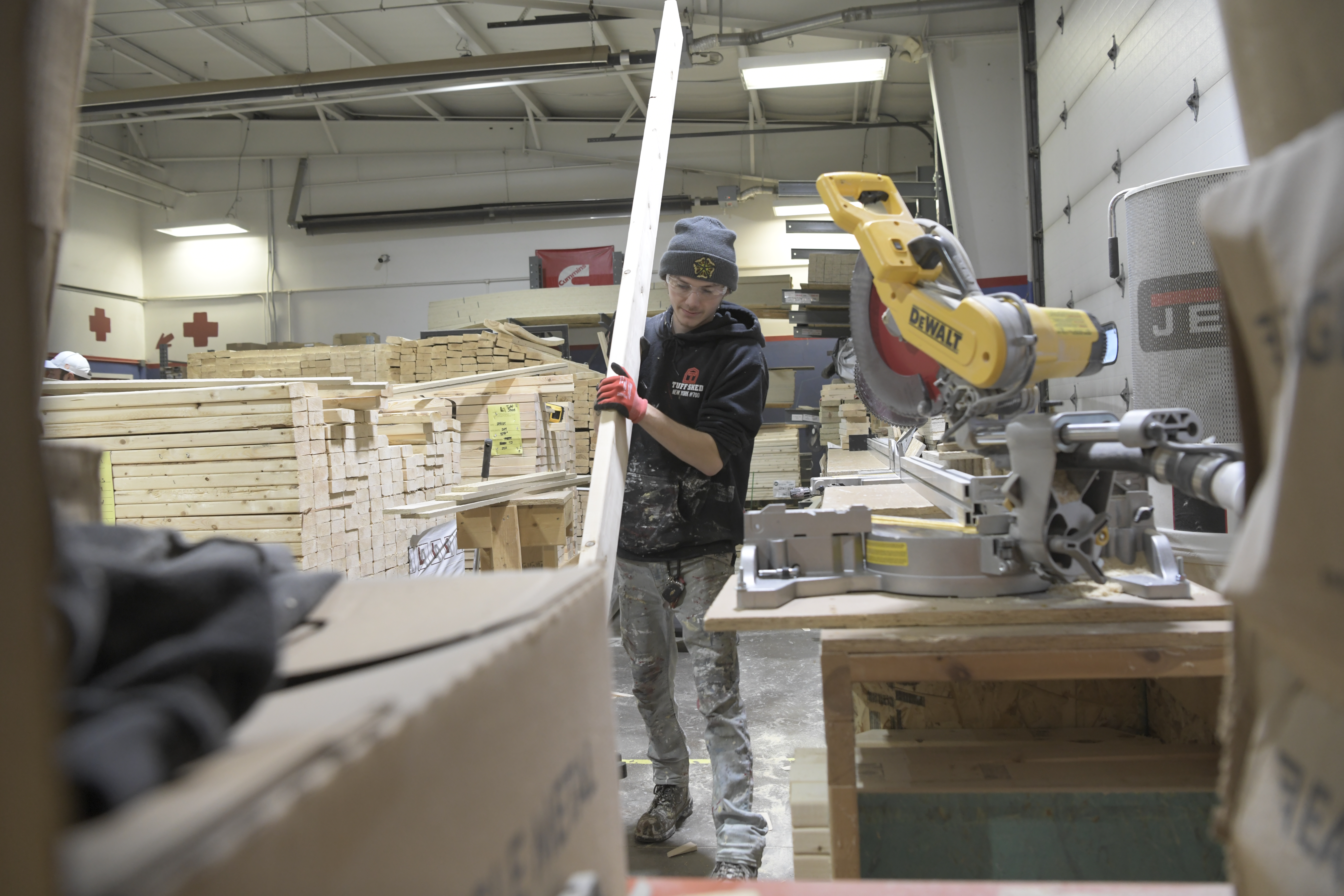 Tuff Shed employee building components of a building in a factory